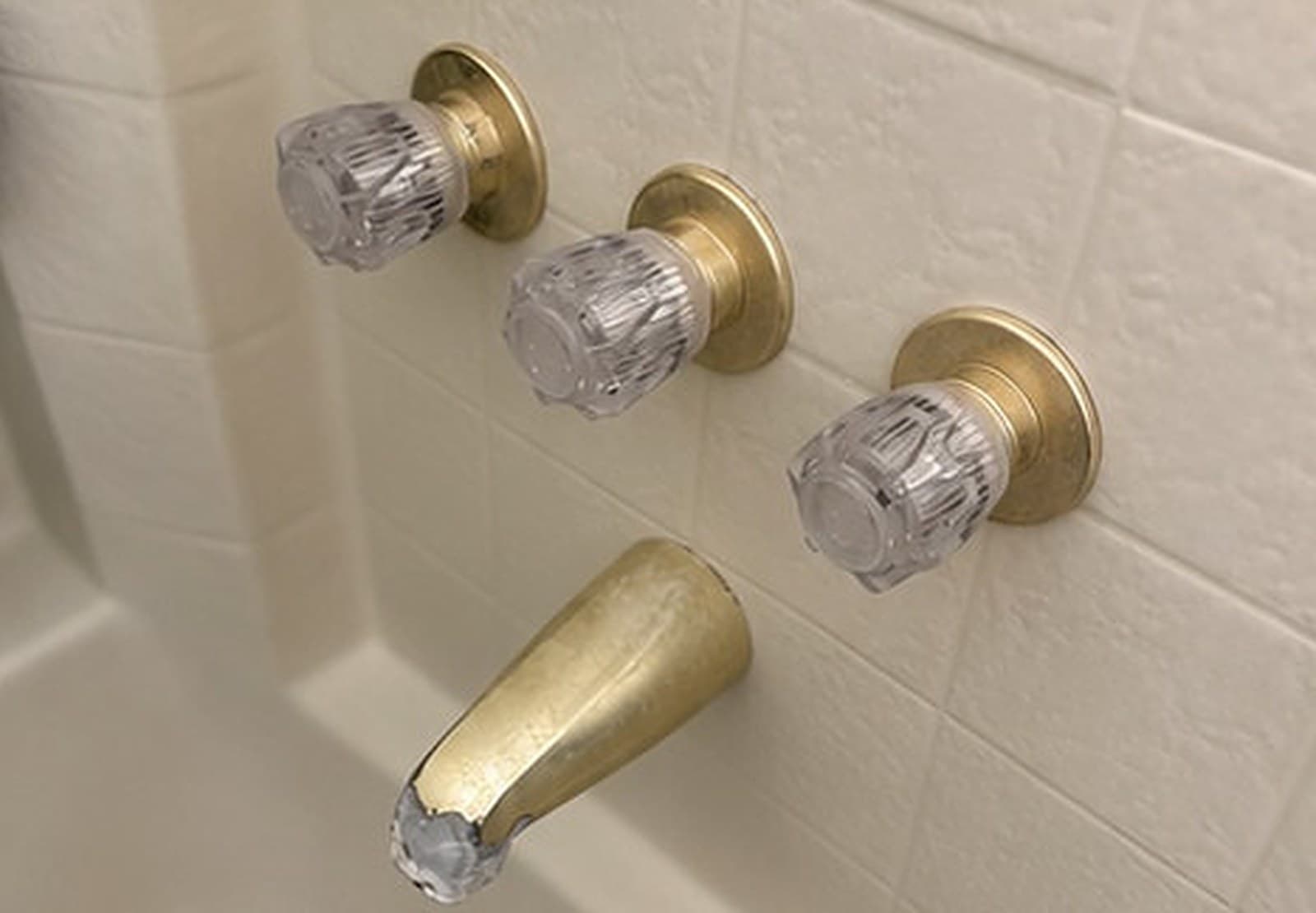 Bathtub with old brass faucet handles and spout