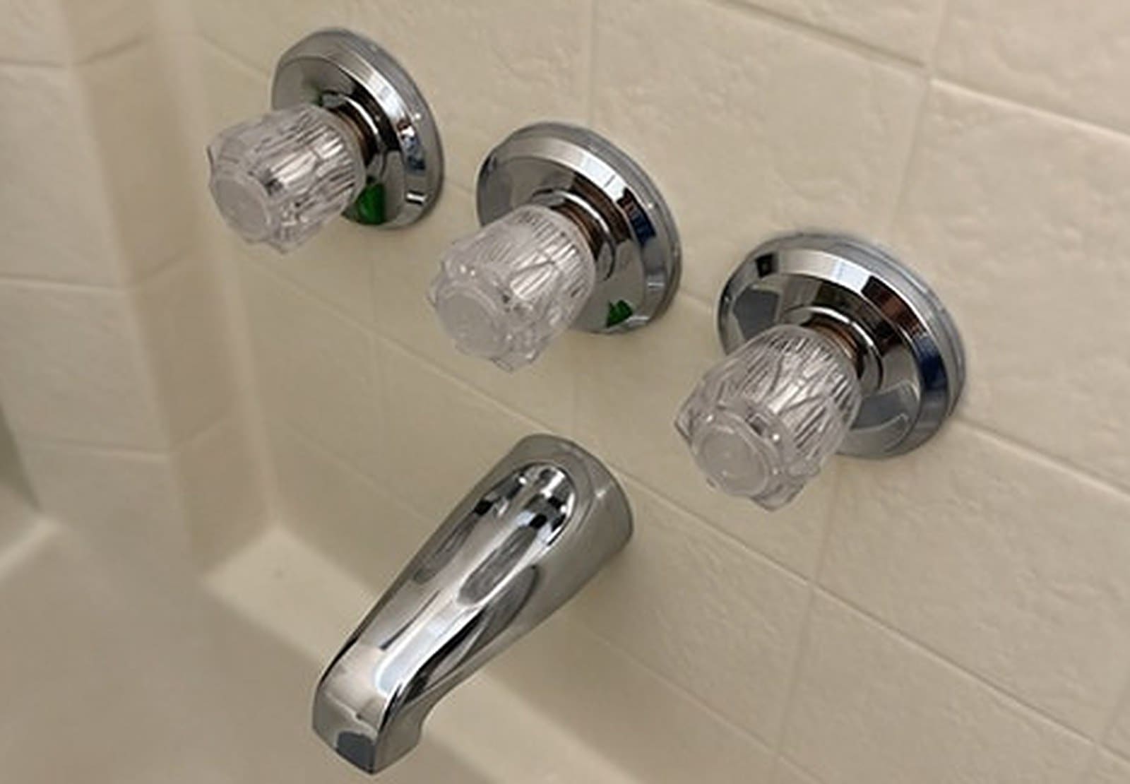 Bathtub with new chrome handles and spout