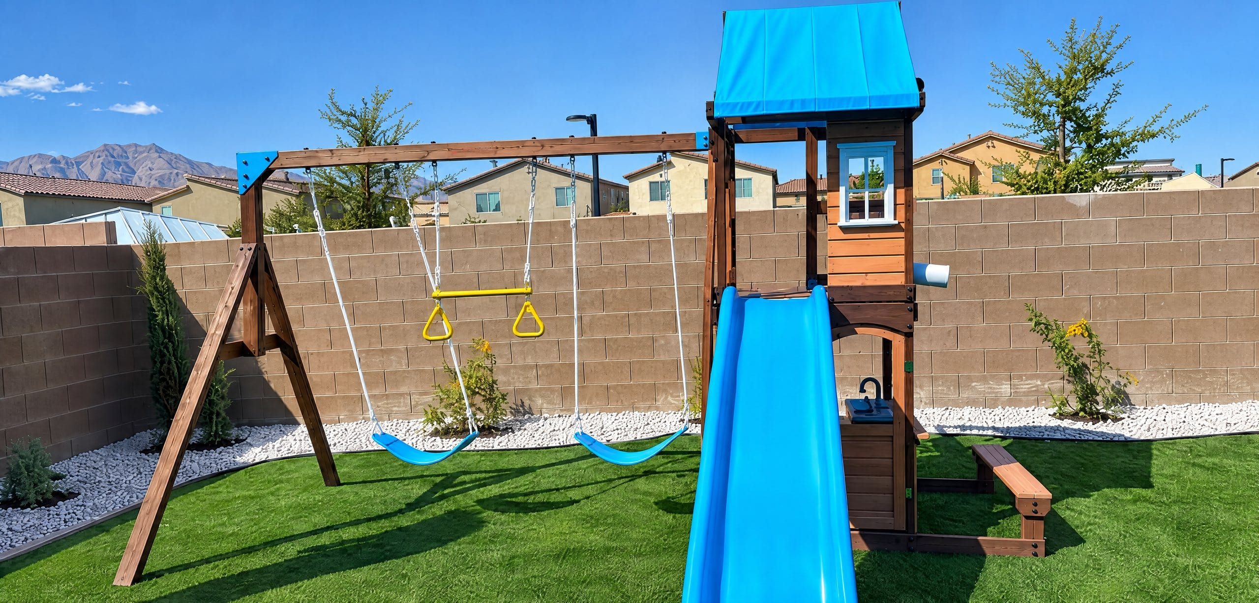 Assembled wooden playset with slide and swings