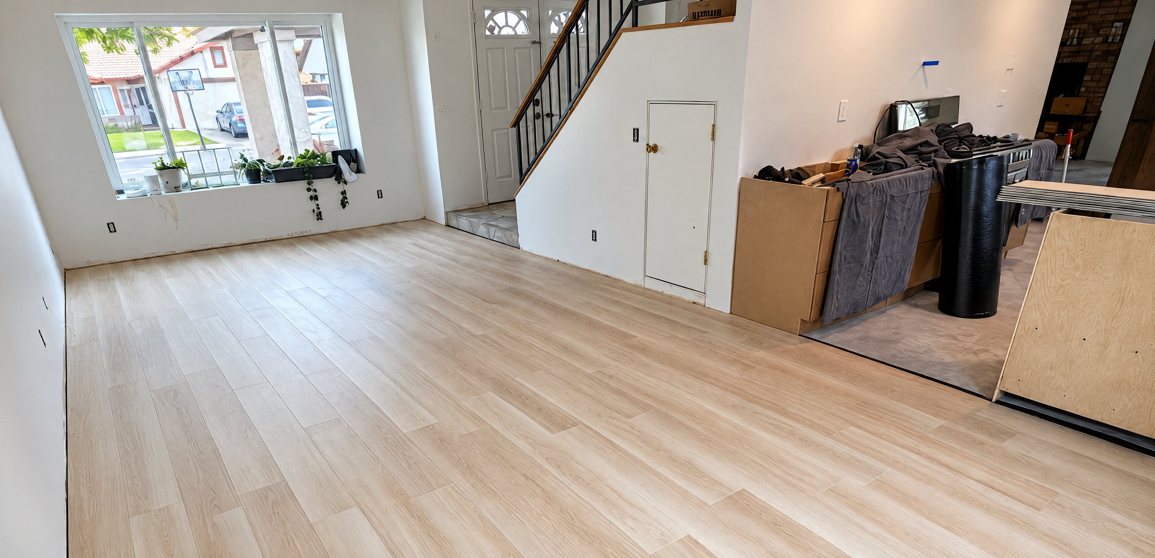 Living room with new light wide-plank flooring