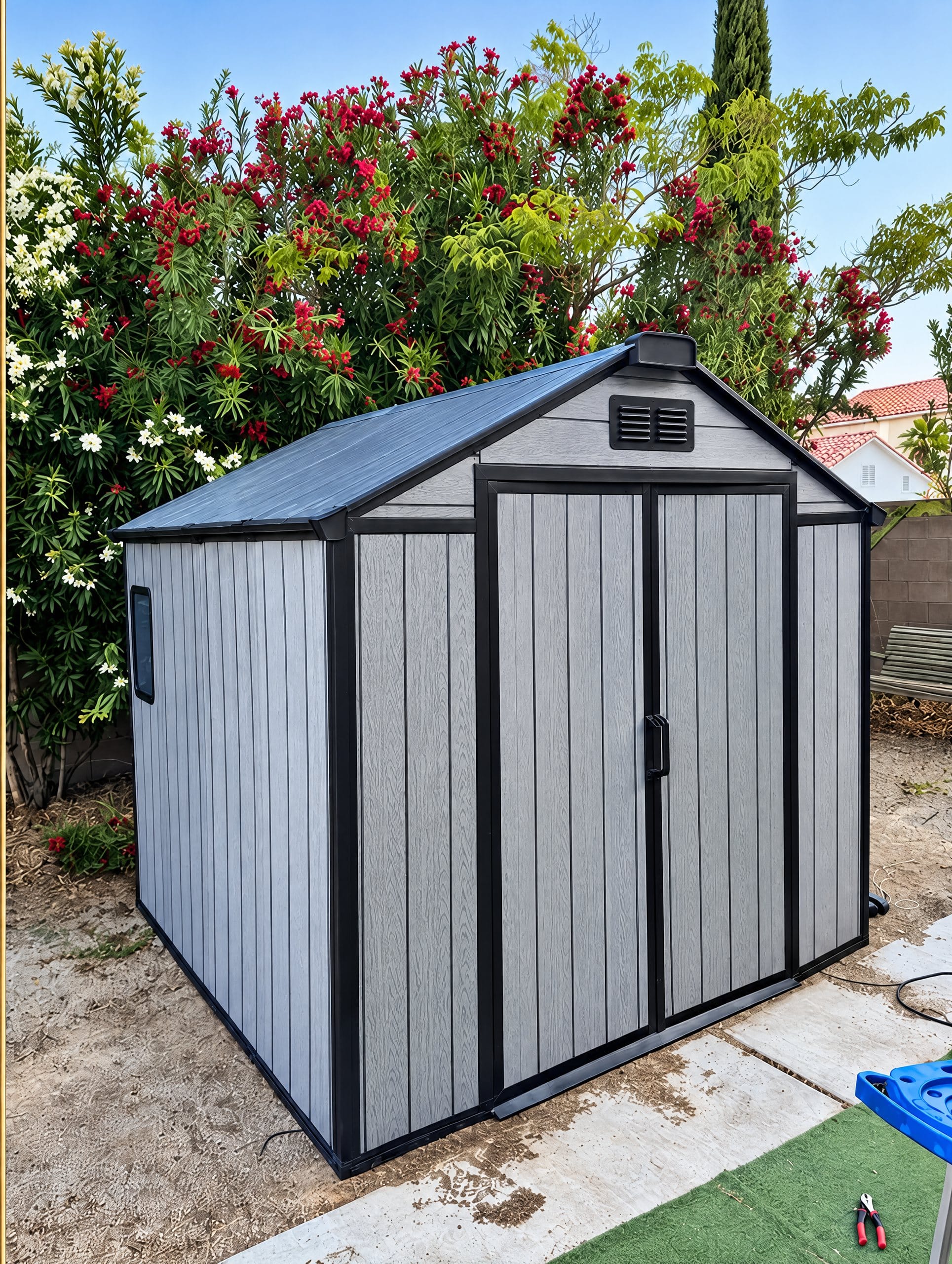 Assembled resin storage shed in a backyard