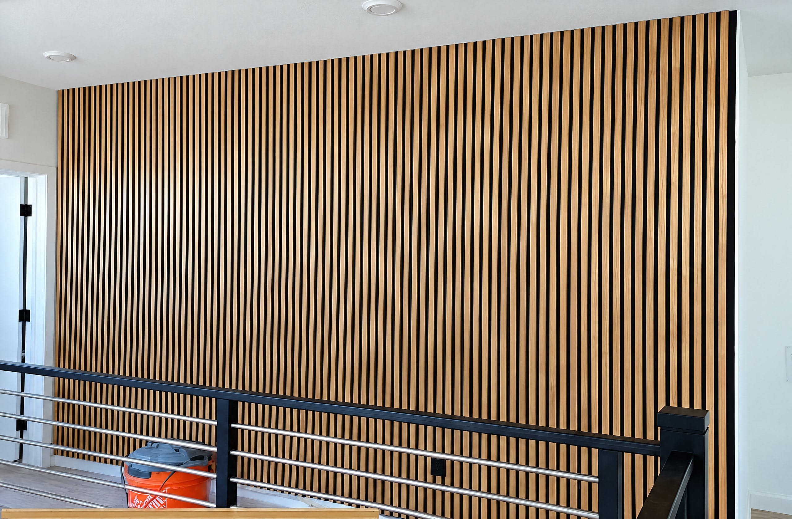 Wood slat wall along a staircase landing